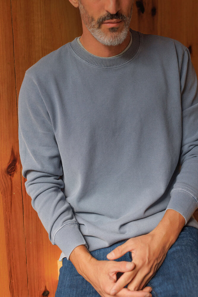 Man wearing Alex Crane caza crewneck in wave