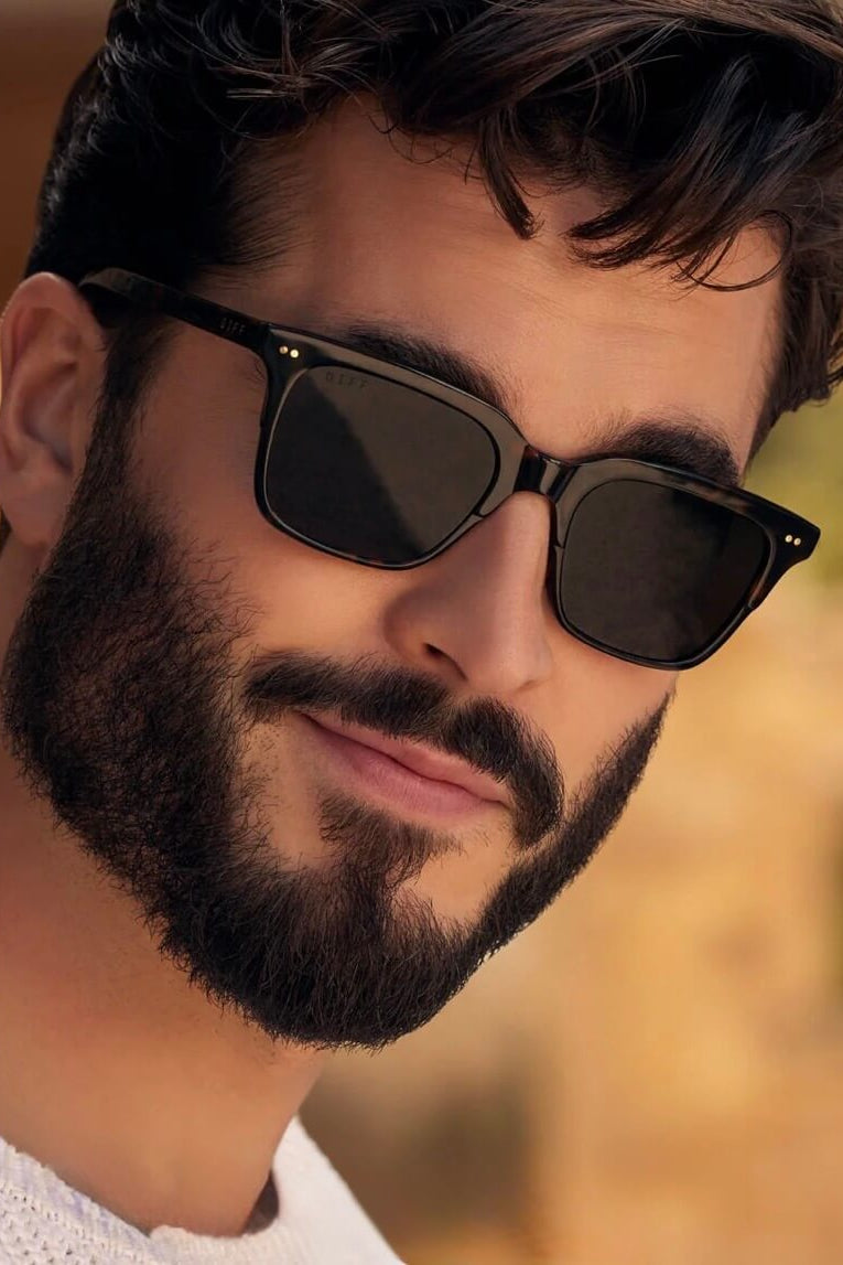 Man Wearing the Diff Eyewear Billie Polarized Sunglasses in Shadow Tortoise + Grey