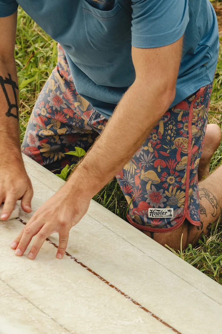 Howler Brothers Bruja men's boardshorts with drawstring waist, draining front pockets and scalloped leg openings