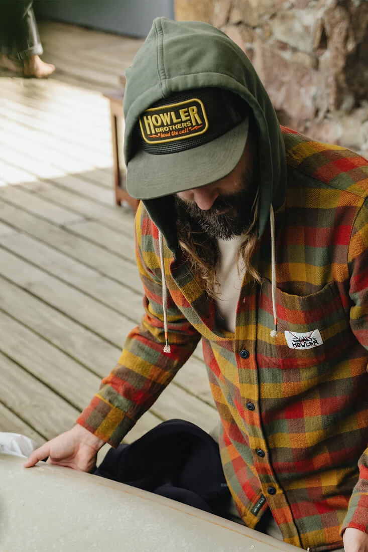 Howler Brothers Inside Out Feedstore Snapback men's unstructured five-panel mesh hat with pliable bill and adjustable snapback closure.