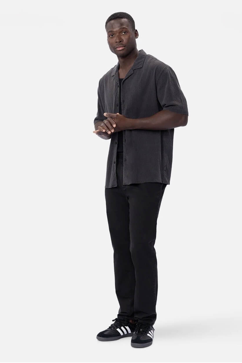 Man wearing The Magna Short Sleeve Shirt in Onyx
