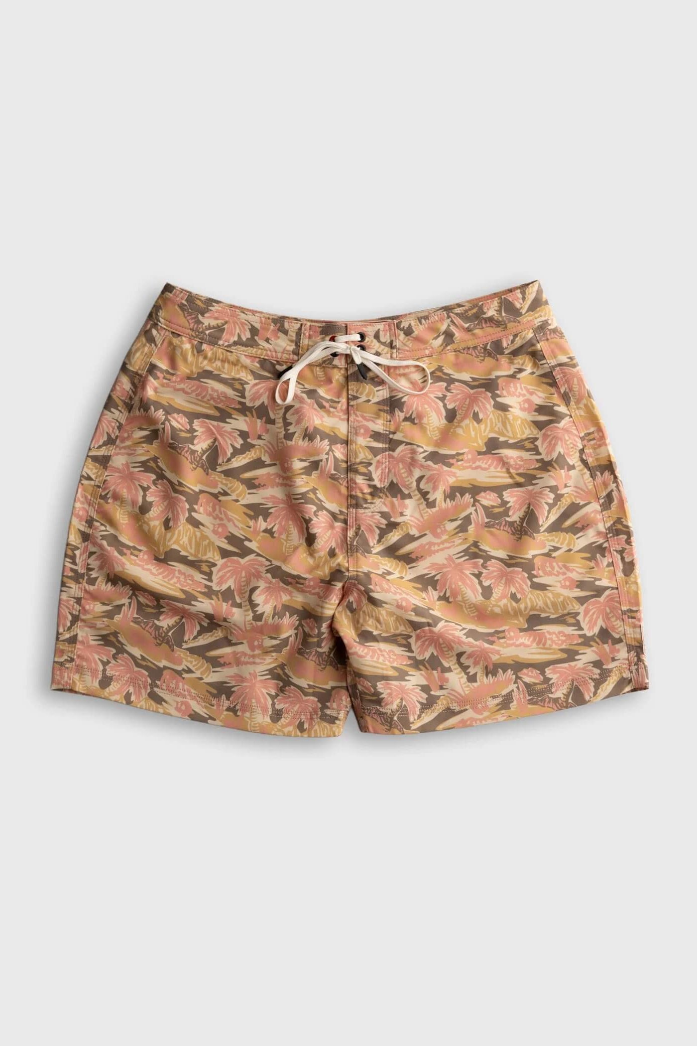 A pair of men's swim shorts featuring an all-over tropical leaf pattern in shades of pink, beige, and brown, with a white drawstring at the elastic waistband, shown against a light gray background.
