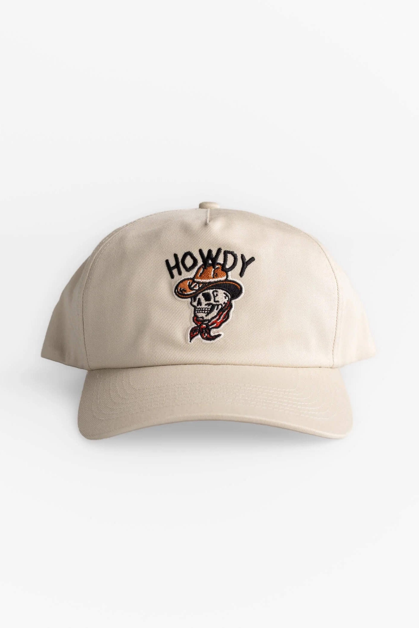 Beige cap with skull design and 'HOWDY' text on a white background