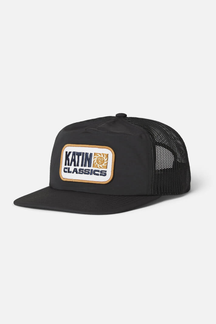 Katin Helios Trucker Hat featuring a custom logo patch, recycled nylon crown and brim, mesh back, flat brim, and adjustable snapback closure.