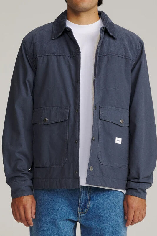 Katin Yukon Jacket featuring a quilted cotton canvas shell, corduroy collar, sherpa lining, snap-front closure, and utility pockets.