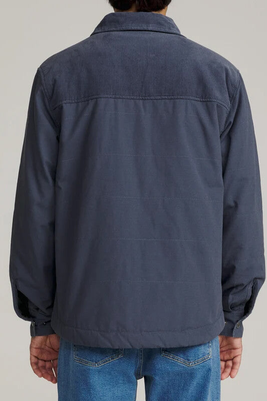 Katin Yukon Jacket featuring a quilted cotton canvas shell, corduroy collar, sherpa lining, snap-front closure, and utility pockets.