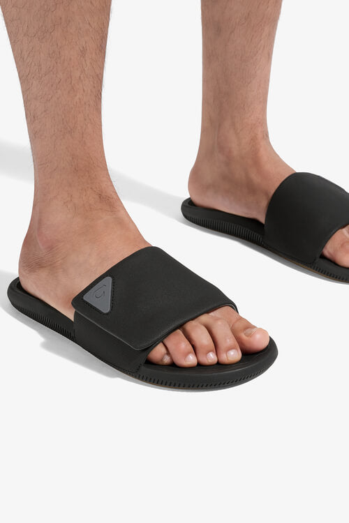 OluKai Ulele Slide in lava rock