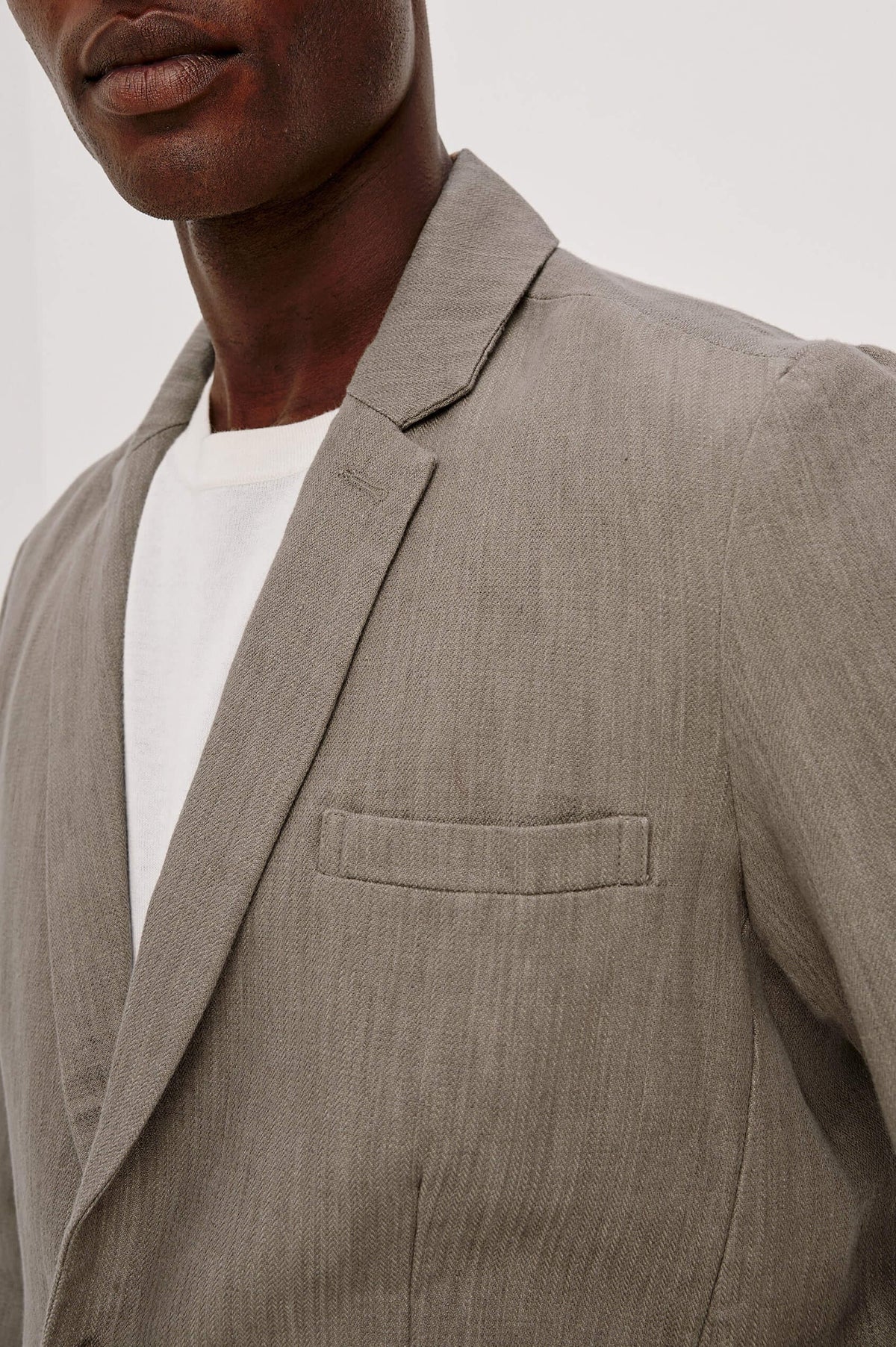 Close-up of Rails Bond Blazer Walnut worn by a person against a neutral background
