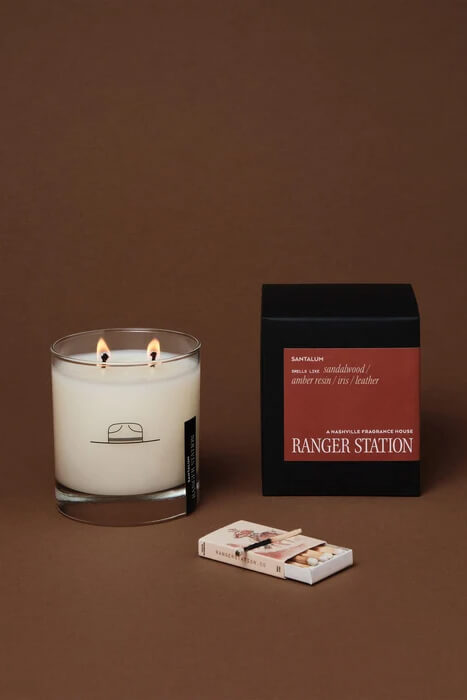 Ranger Station Santalum Candle 8 oz. soy wax blend candle with sandalwood, amber resin, iris and leather fragrance notes.