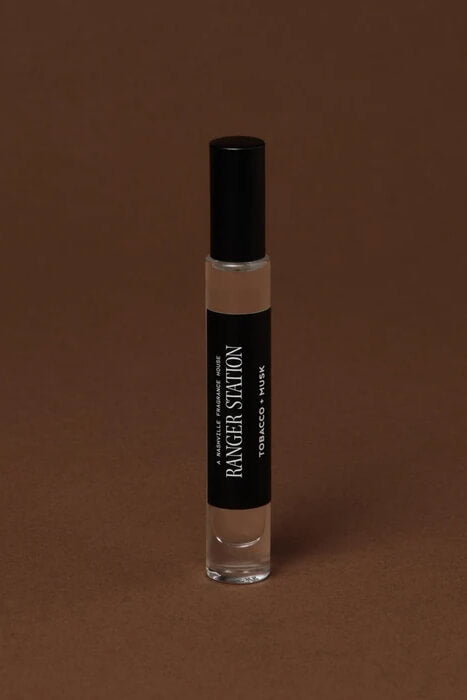 Ranger Station Tobac + Musk Perfume with sweet pipe tobacco, blue musk, clove and amber notes, available in Quickdraw rollerball and spray sizes.