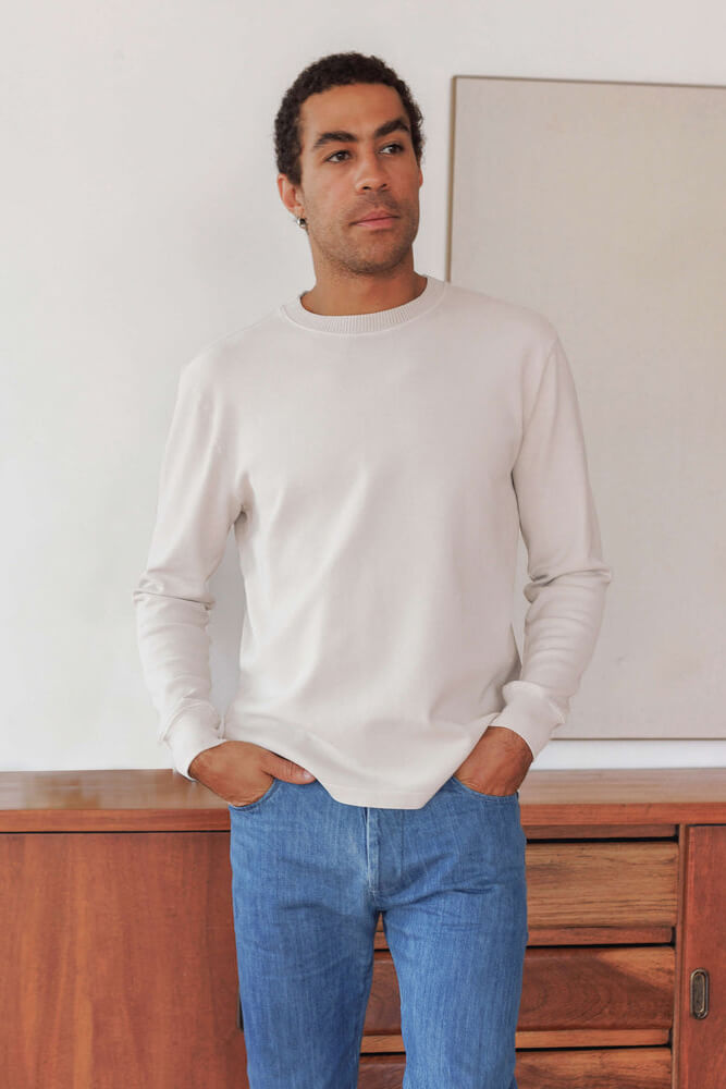 Man wearing Alex Crane caza crewneck in cream