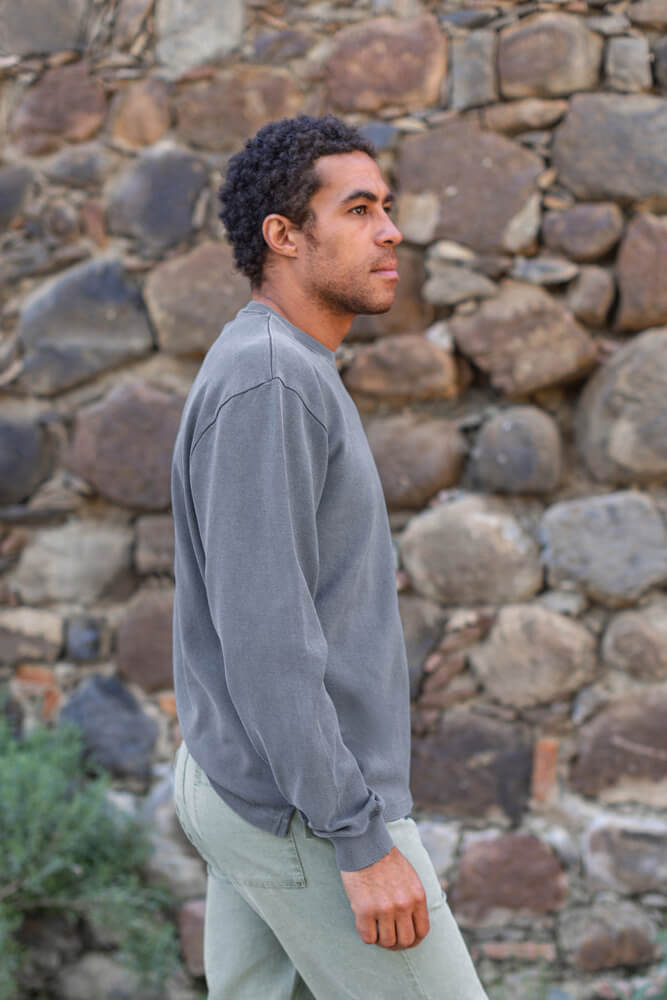 Man wearing Alex Crane caza crewneck in slate