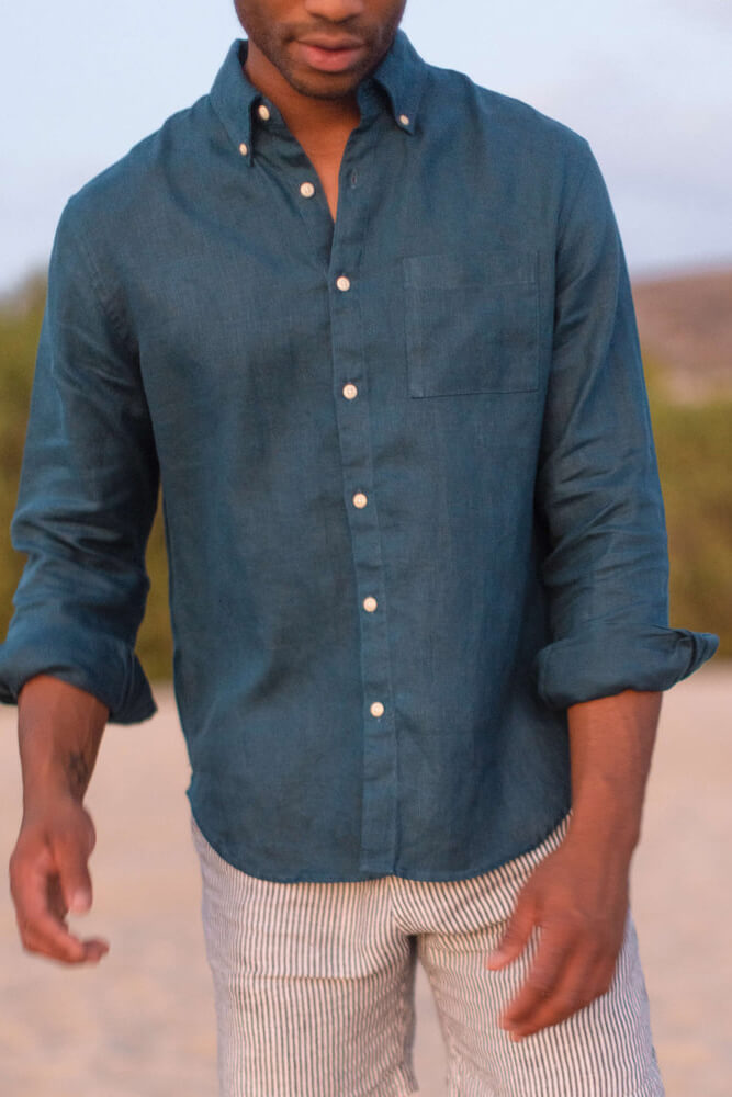 Man wearing the Alex Crane playa shirt in dusk