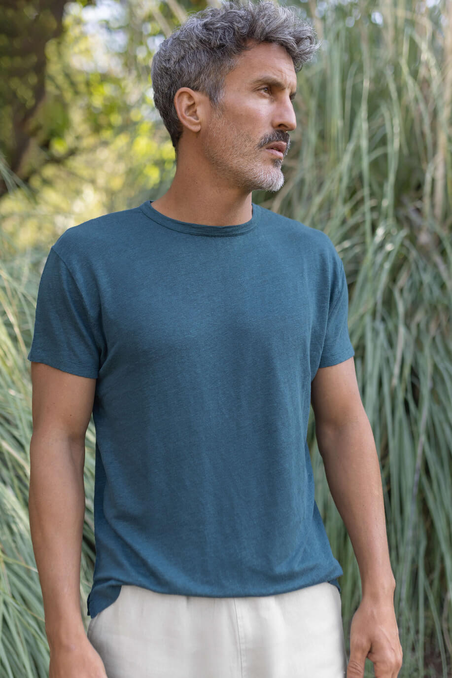 Man wearing the Alex Crane Sun Tee in dusk