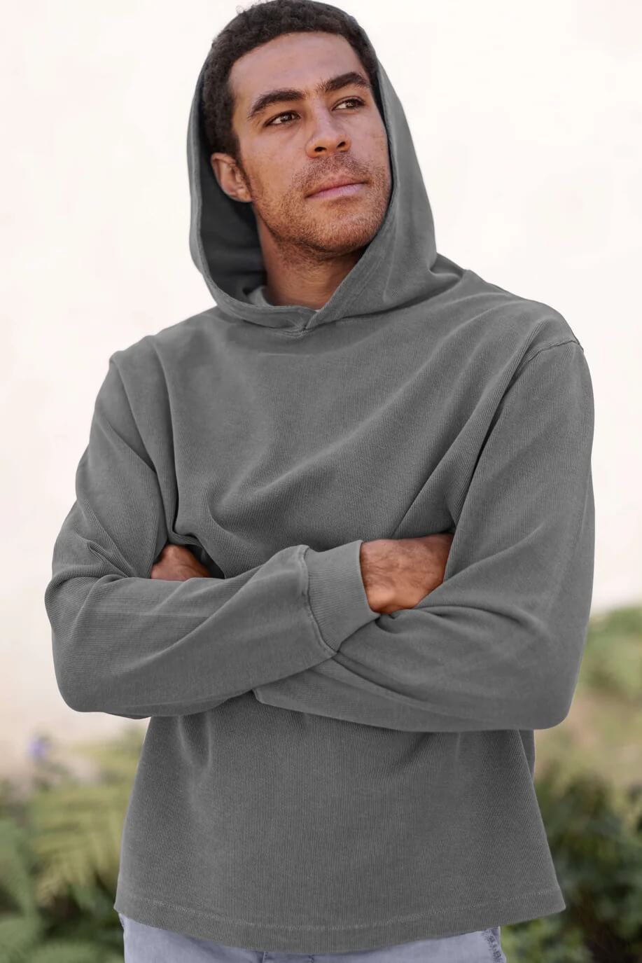 Man wearing the Alex Crane Caza Hoodie in Slate