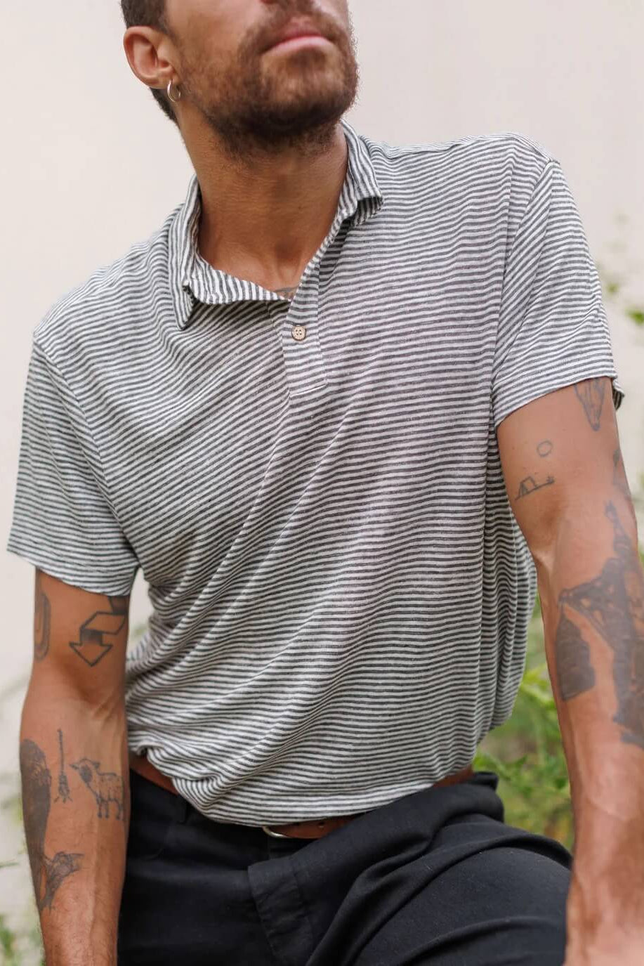 Model wearing the Alex Crane Knit Polo in Lines
