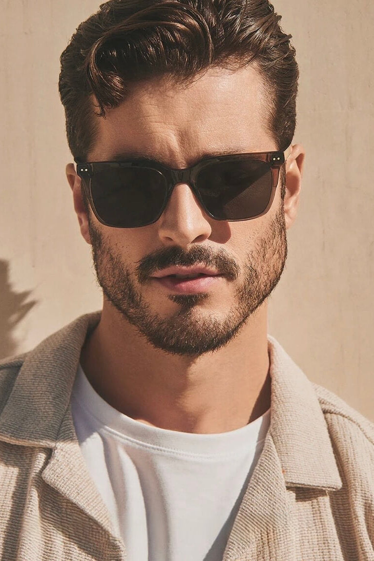 Man wearing the Diff Eyewear Billie Polarized Sunglasses in Black Smoke Crystal