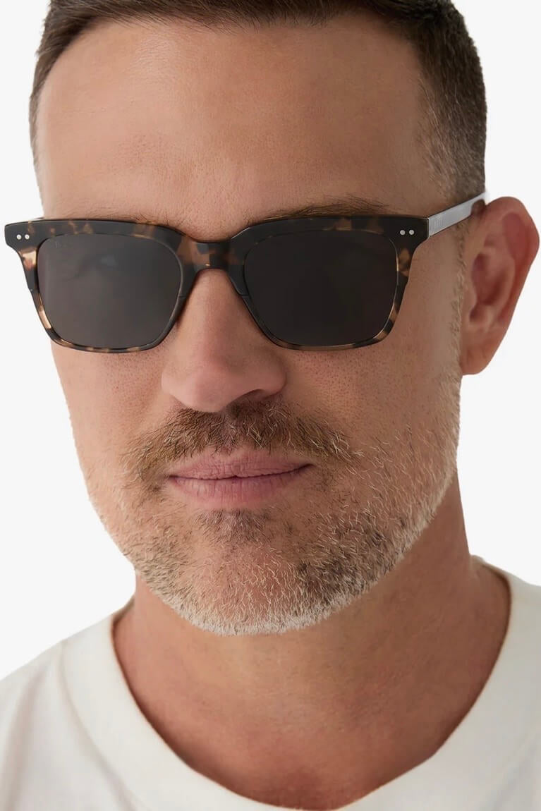 Man wearing the Diff Eyewear Billie Polarized Sunglasses in Espresso Tortoise + Grey