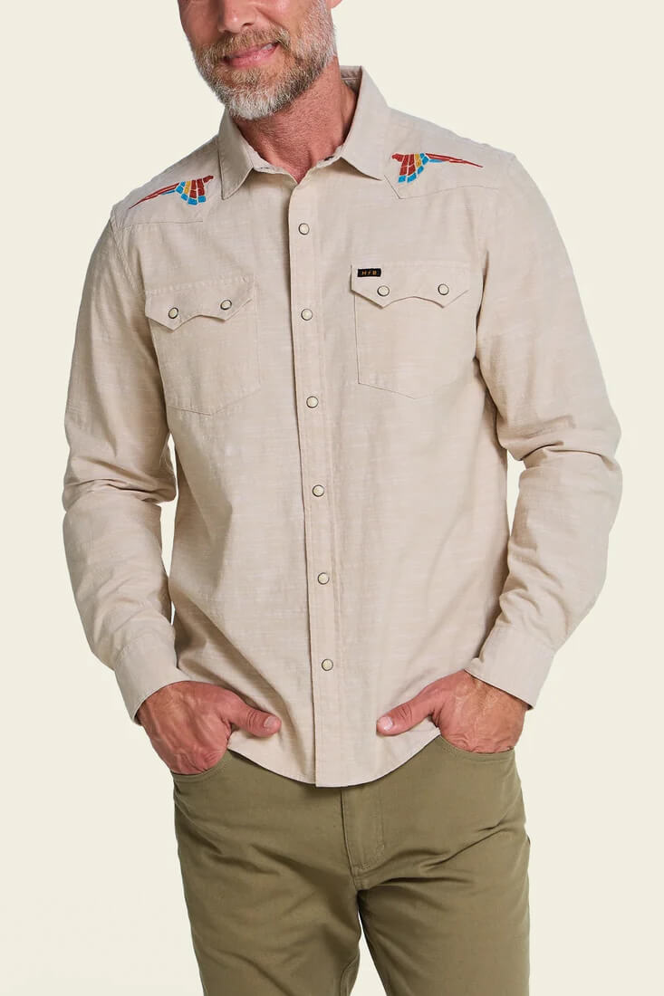 Howler Brothers Crosscut Deluxe Snapshirt men's regular-fit stretch chambray shirt with custom embroidery, western yokes, and pearl snaps.