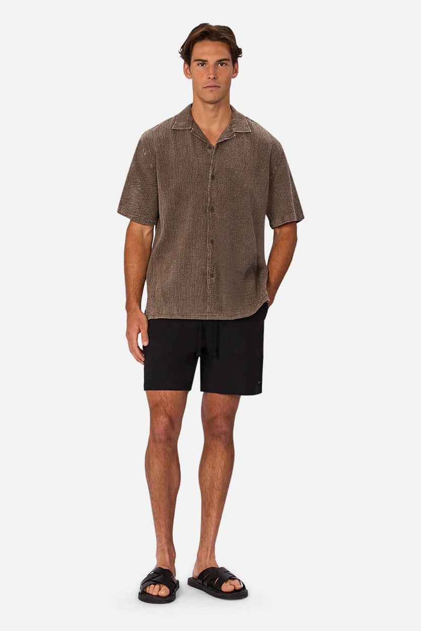 Man wearing  The Canyon Short Sleeve Shirt in Bark 