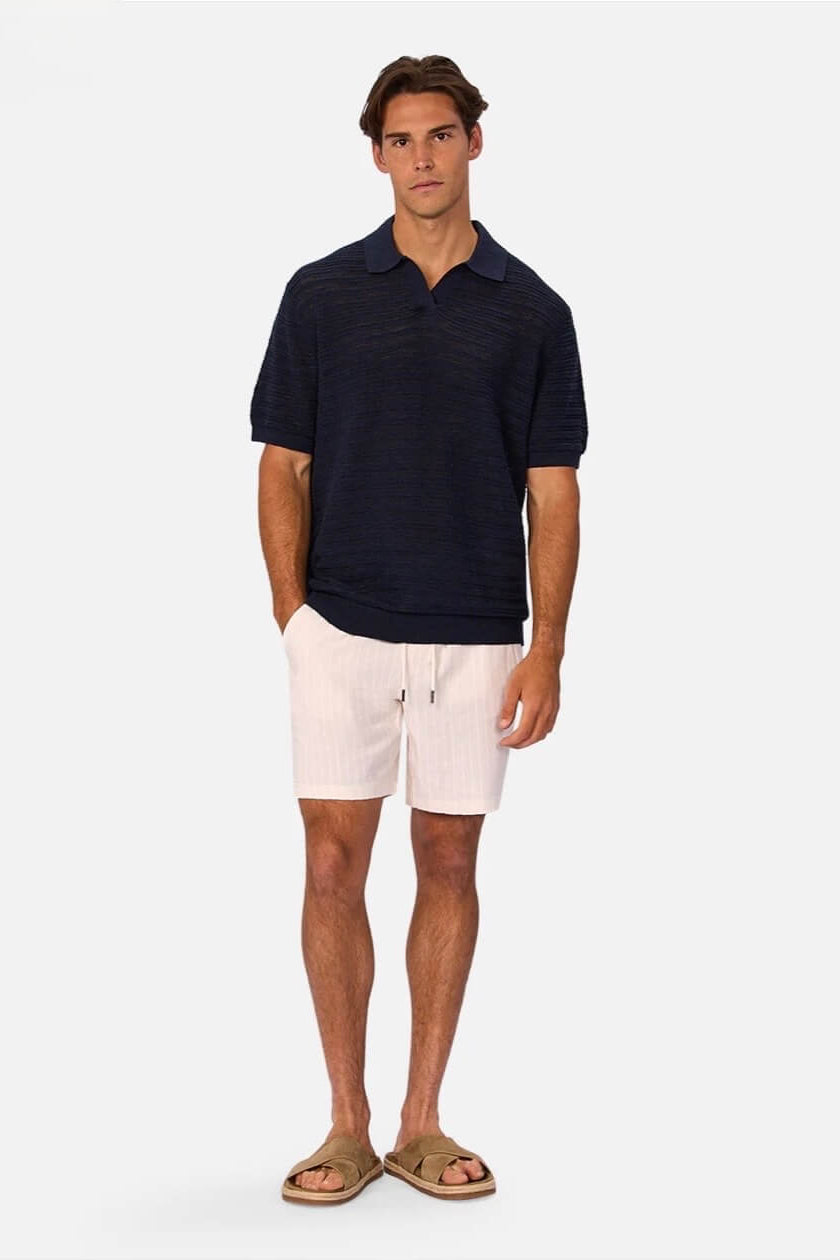 Man wearing The La Brava Short in Wheat/Off White