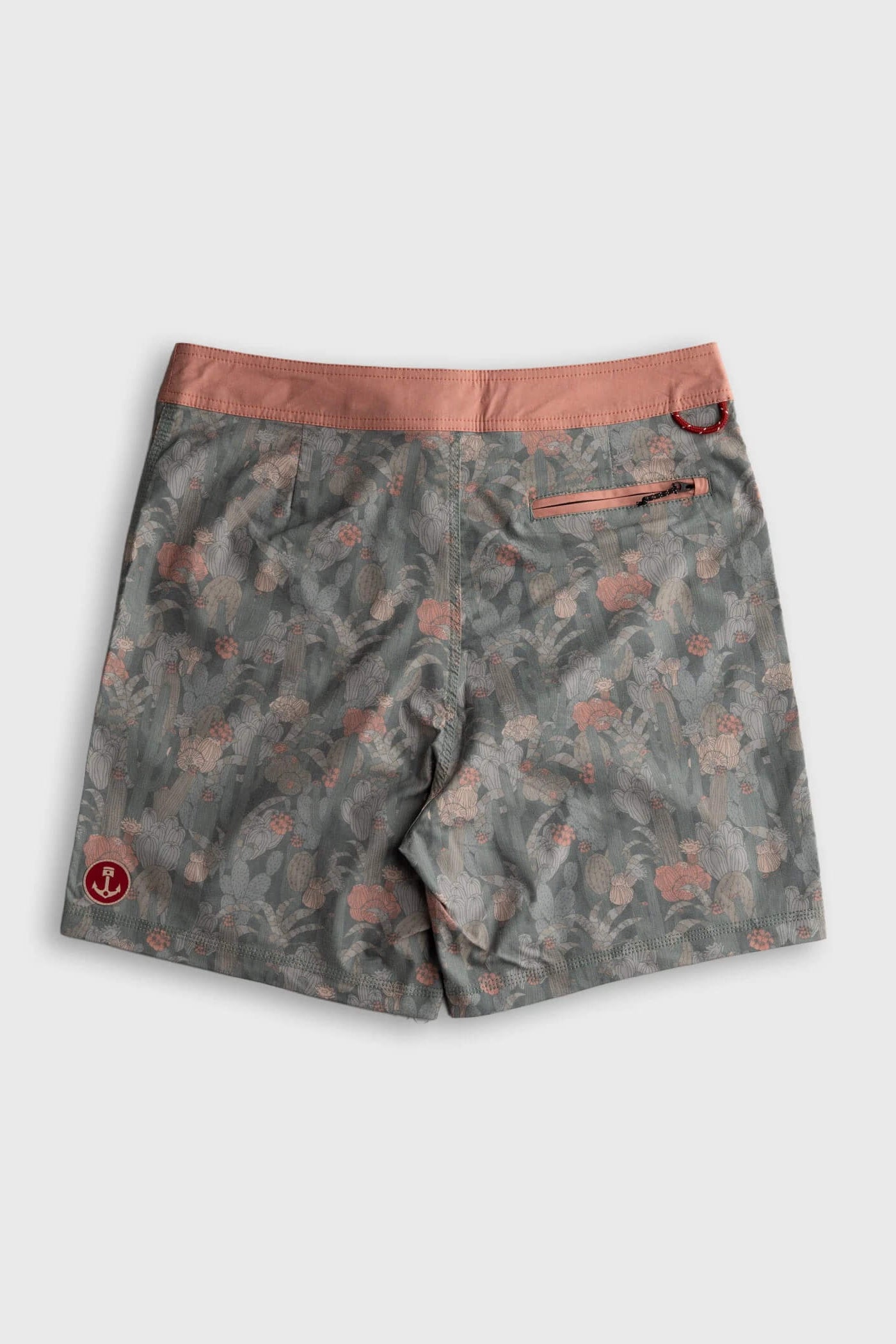Iron & Resin board shorts in a gray and pink floral pattern with a solid pink waistband, shown flat on a light gray background.