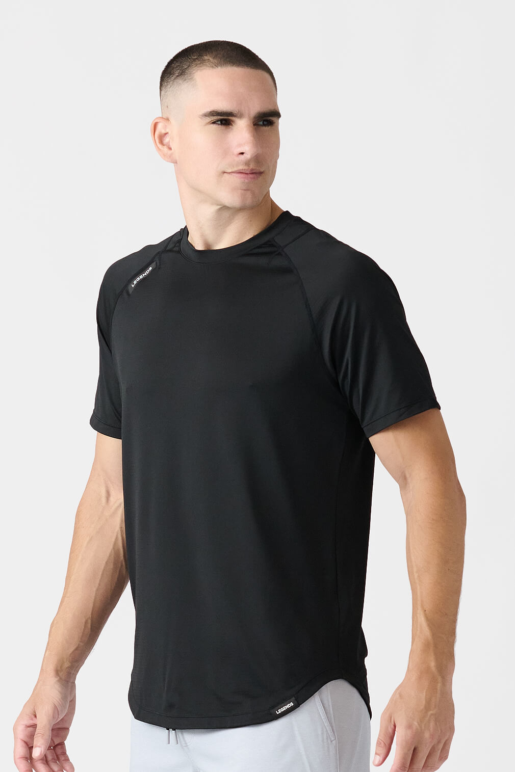 Legends Enzo Tee men's short sleeve performance shirt with athletic fit and scalloped hem