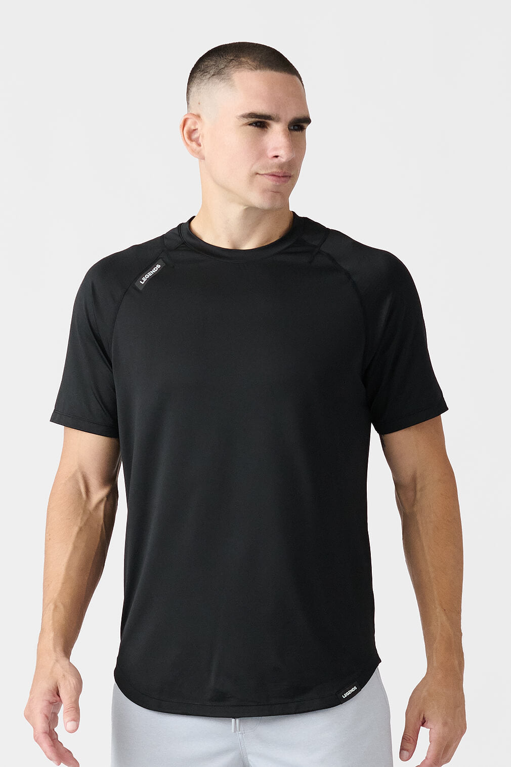 Legends Enzo Tee men's short sleeve performance shirt with athletic fit and scalloped hem