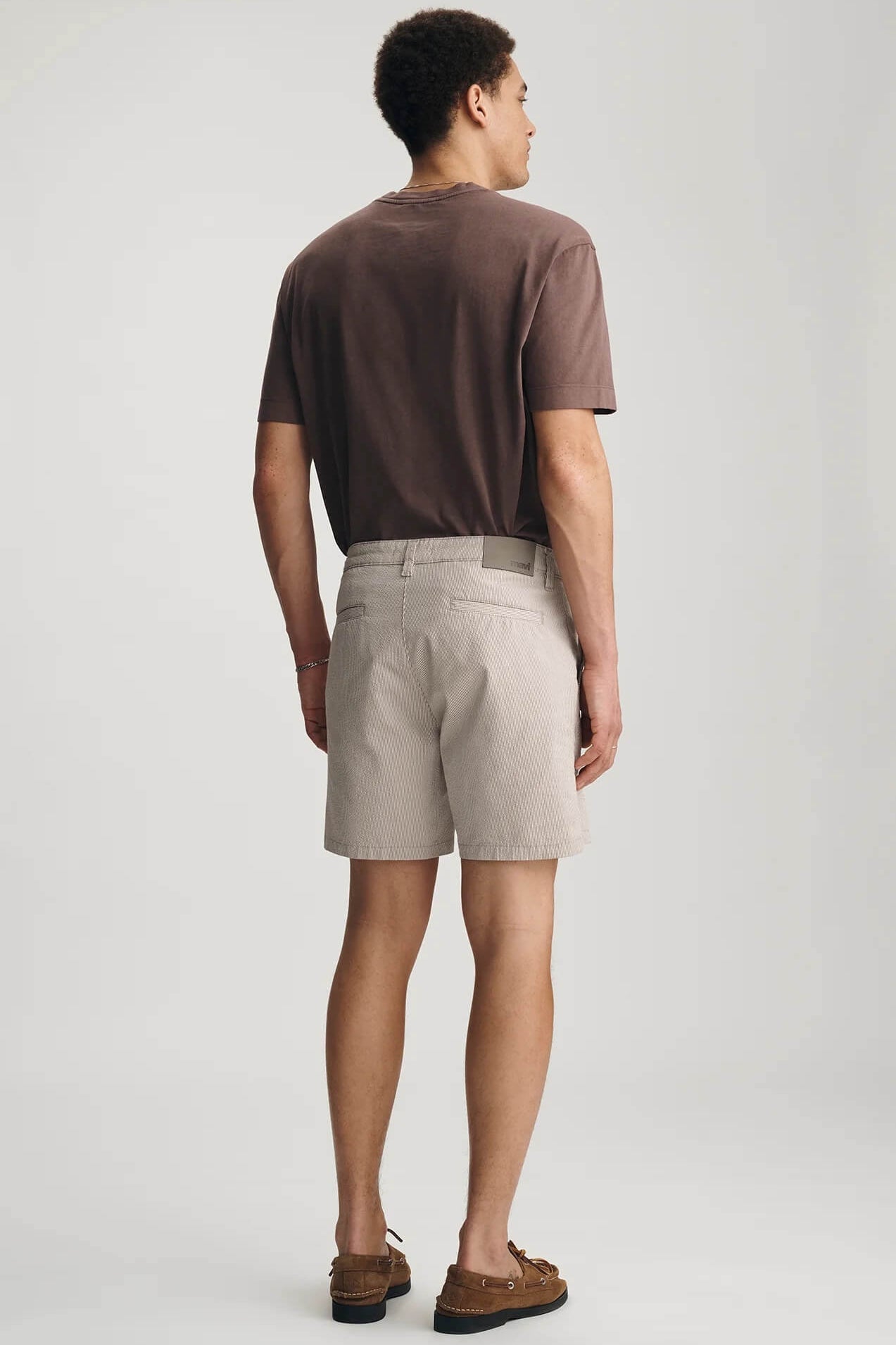 Man wearing Mavi's Nate shorts in Sand Seersucker back 