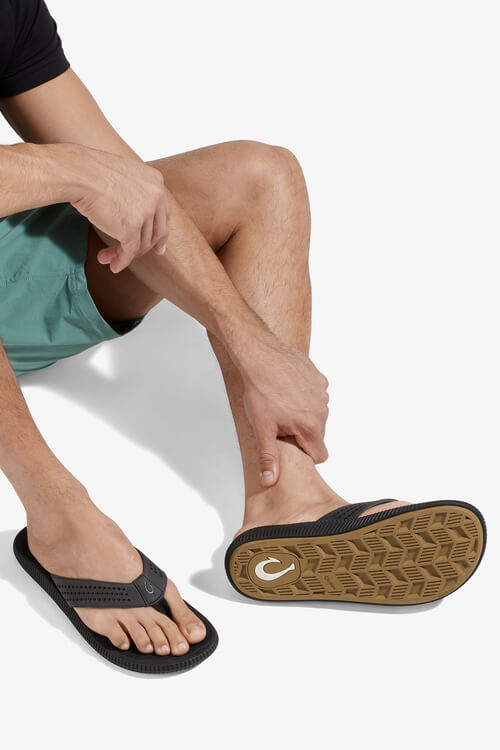 OluKai Ulele Sandal in lava rock