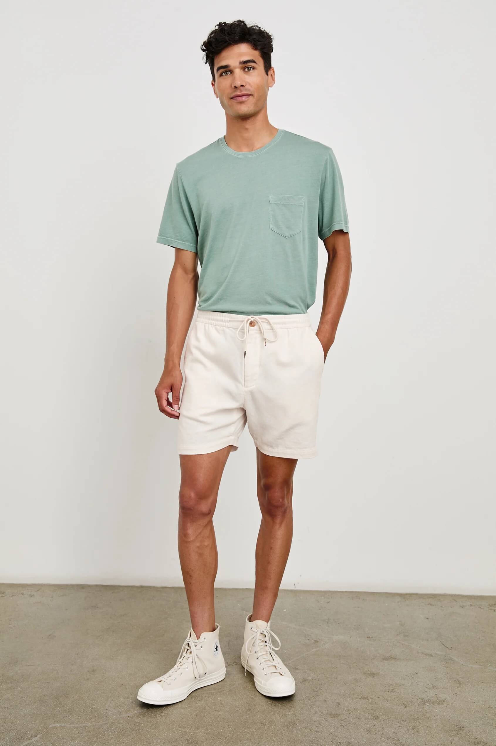 Man wearing the Archer 6" short in Ecru by Rails