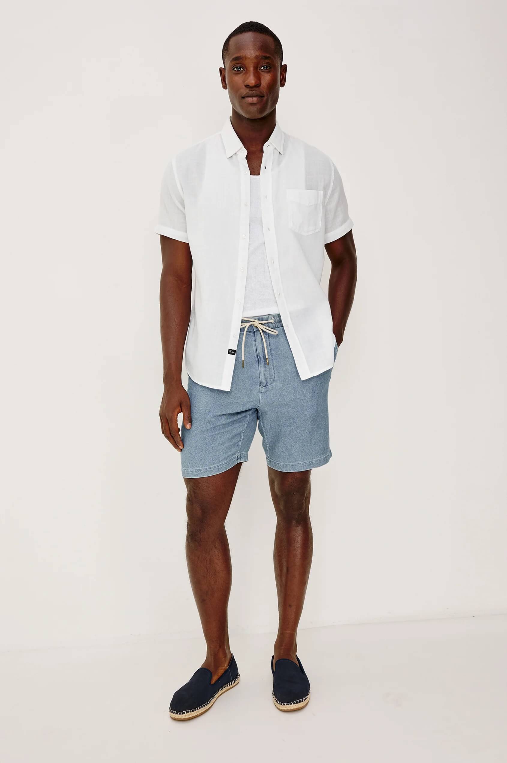 Man wearing the Rails Archer Short in medium wash indigo