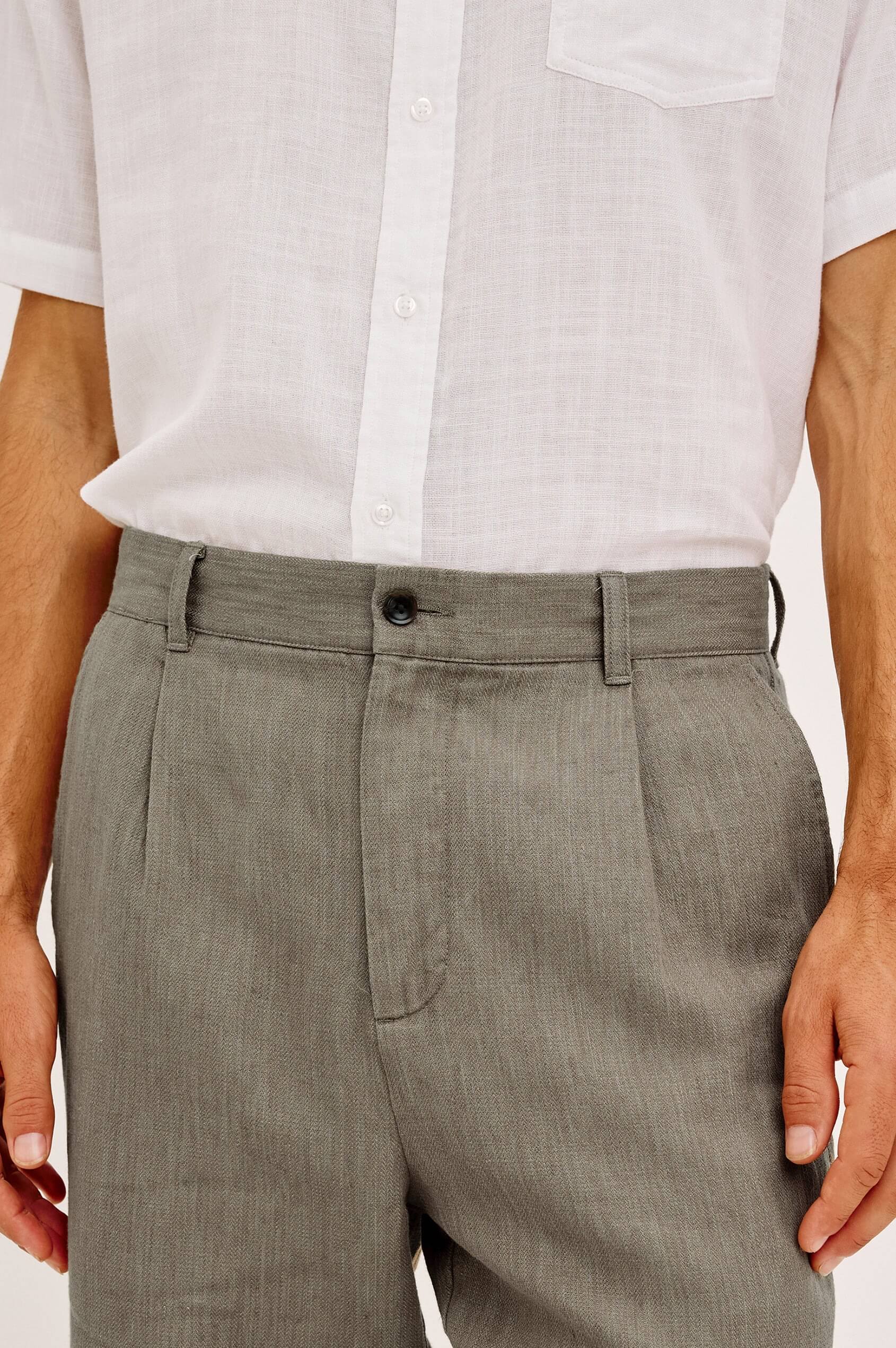 Close-up of a person wearing the Rails Zimmer Pant in Walnut