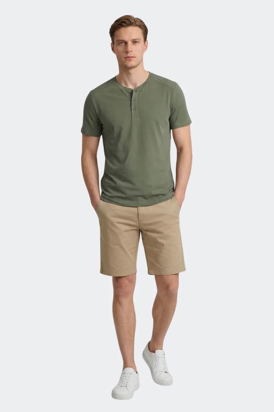 A man modeling the Vuatra Slub Henley Shirt in Olive, against a solid light gray background.