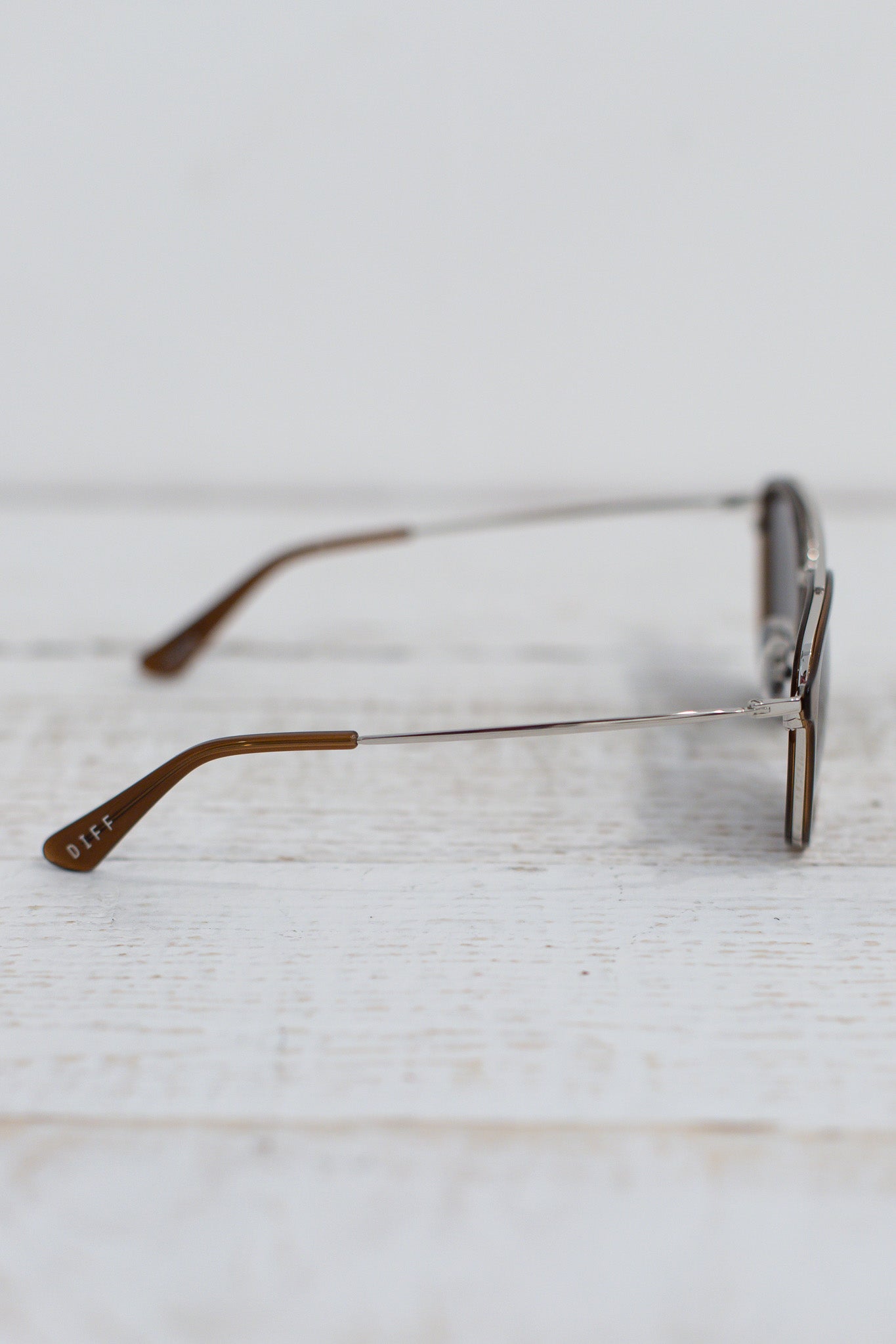 Eyeglasses on a light wooden surface